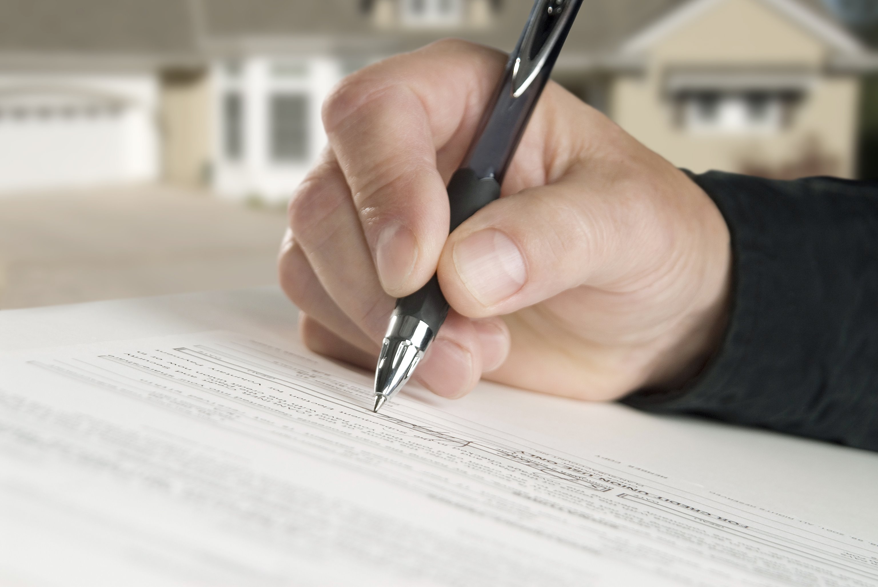 A document being signed before recording